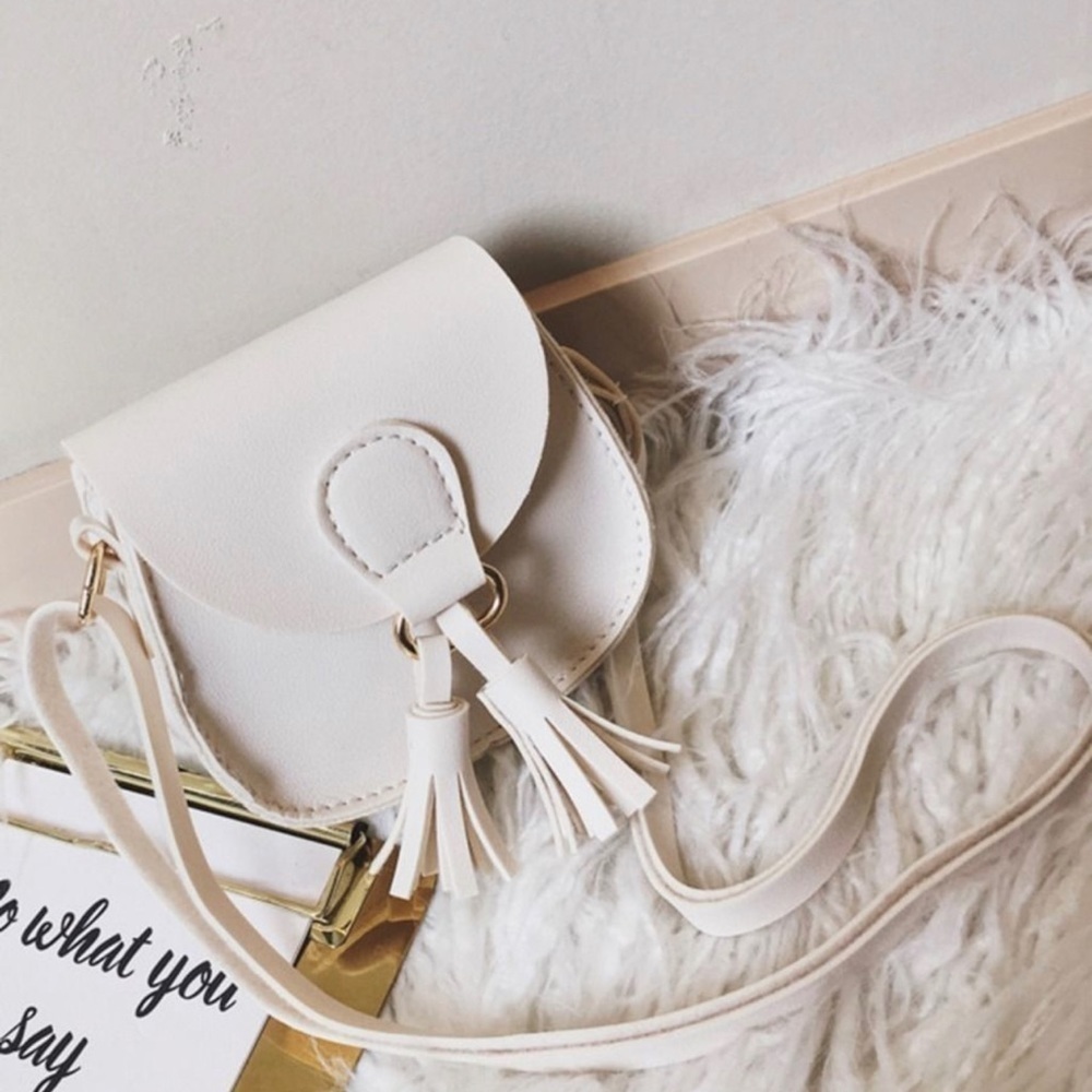 TASSEL crossbody. Ivory faux leather with adjustable strap